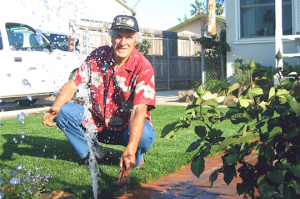 a professional Colleyville sprinkler repair specialist is adjusting a bad pop-up head